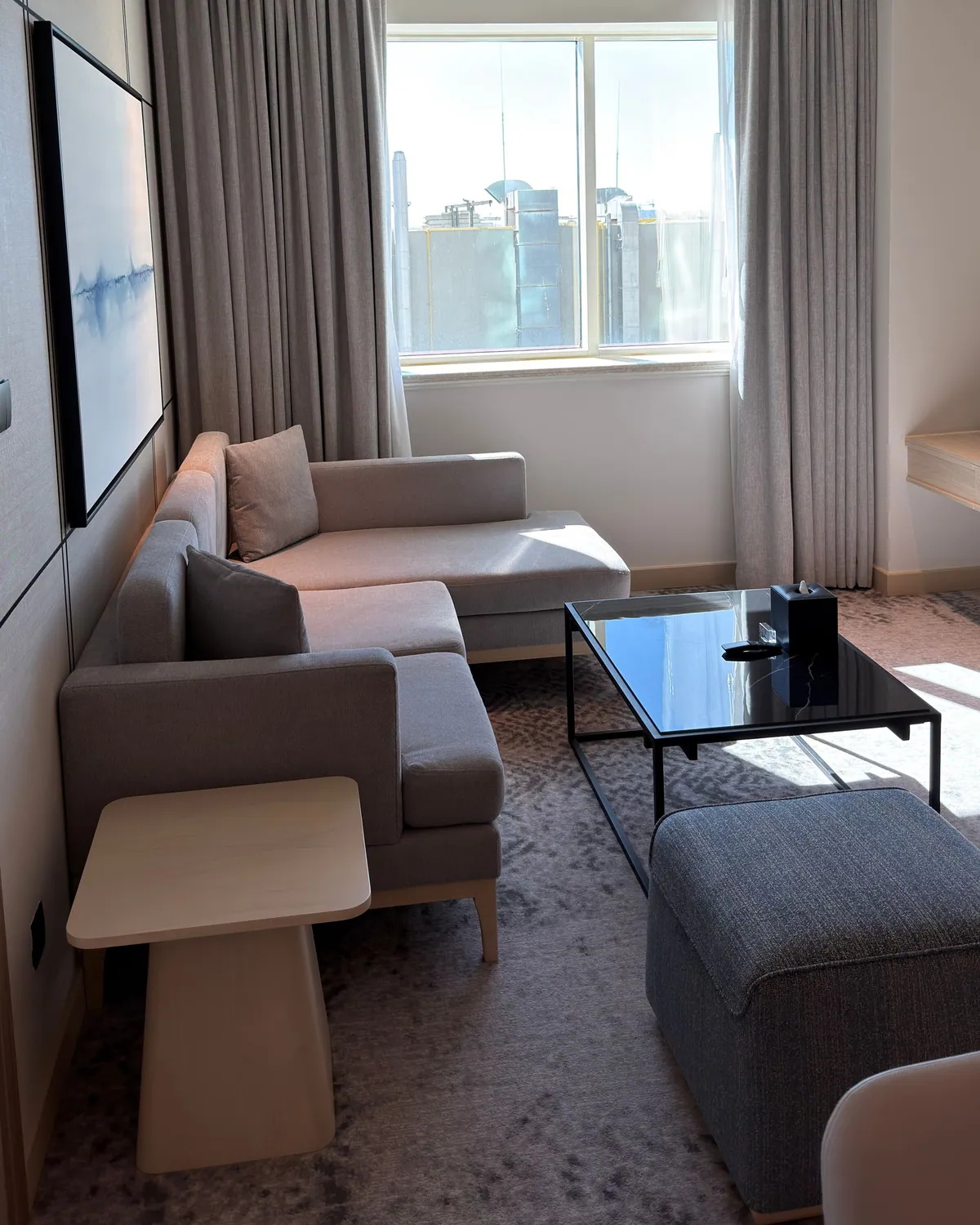 Living room interior with contemporary seating and a designer TV wall