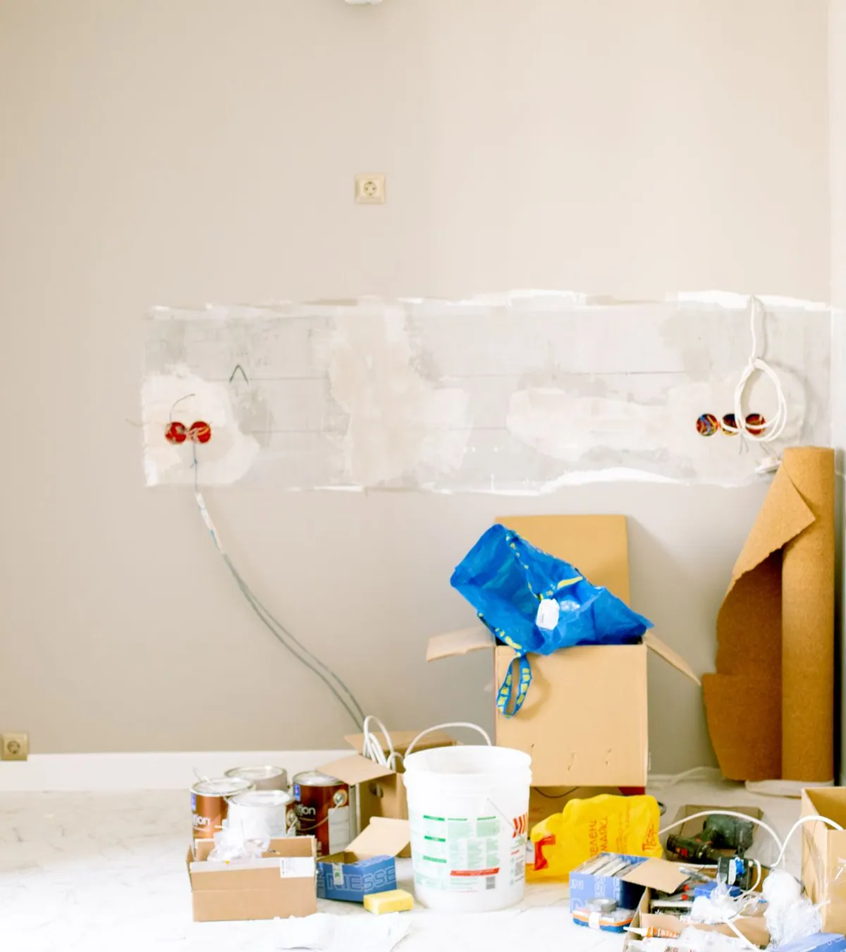 Home renovation in progress showing demolition and finishing work